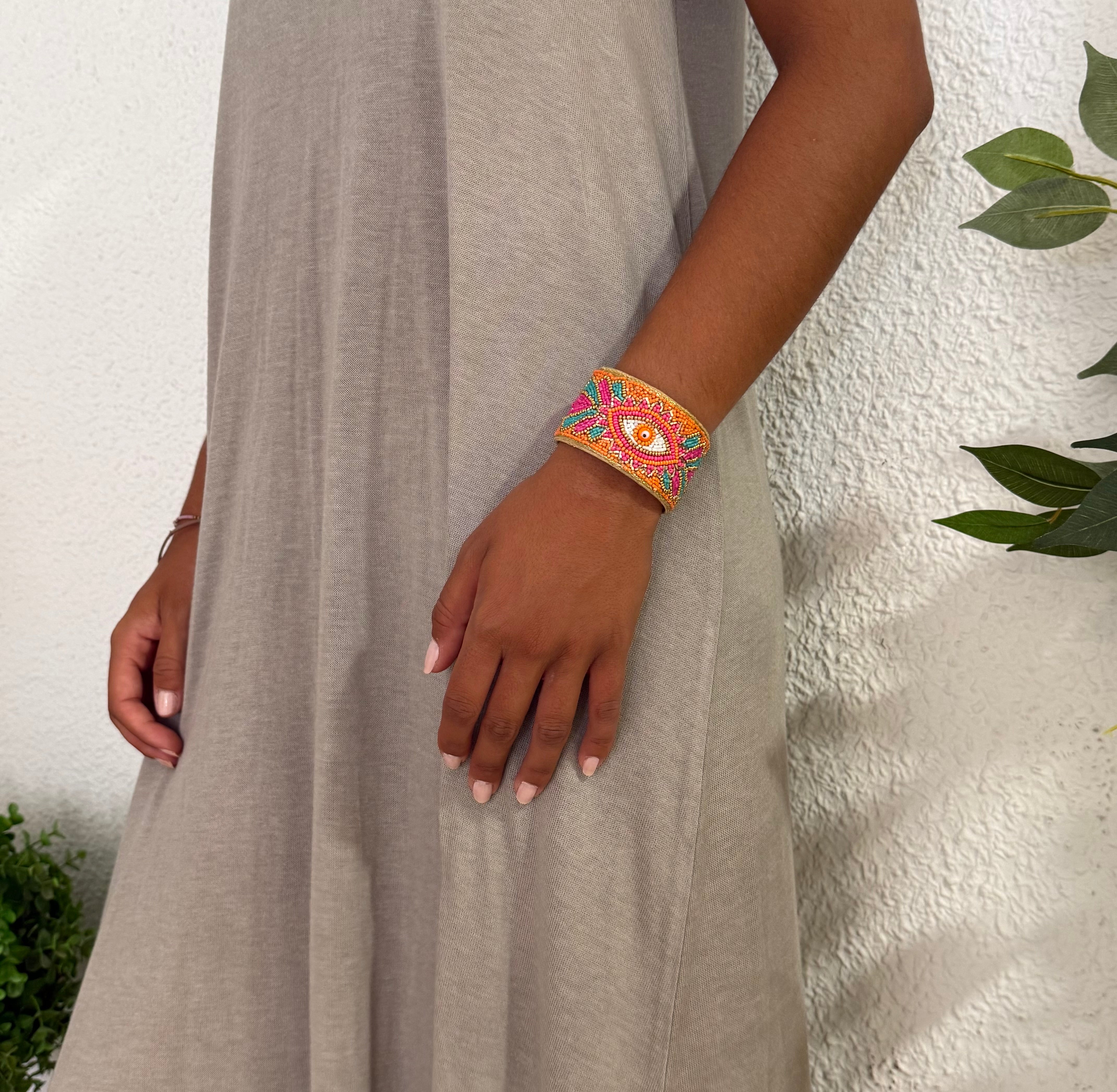 Brazalete "Occhio" naranja y fucsia